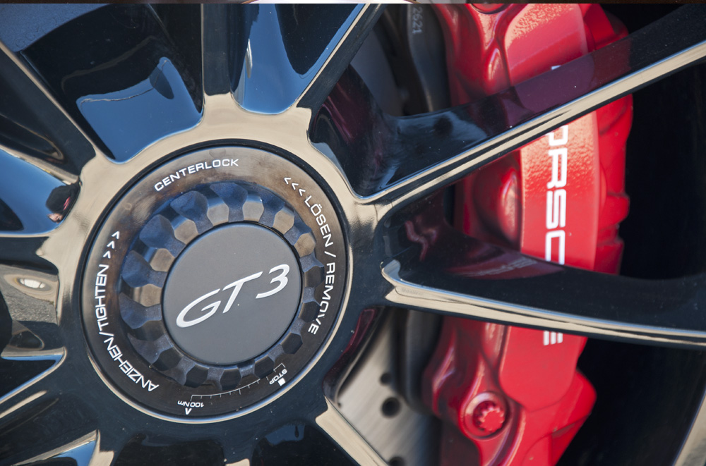 Close up shot of a Porsche 991 GT3 wheel, center cap and brakes.