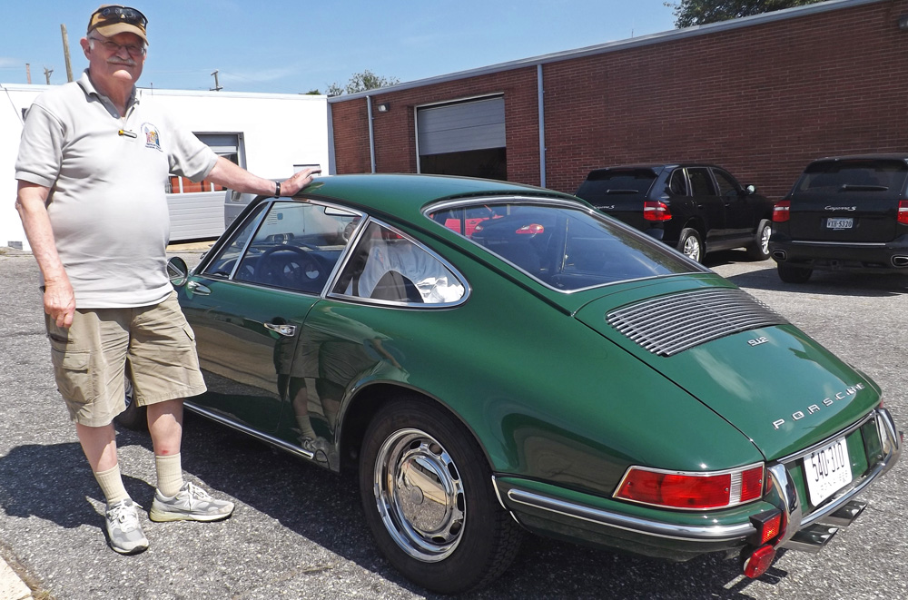 A satisfied Lüfteknic customer stands by his recently restored Irish Green Porsche 912.