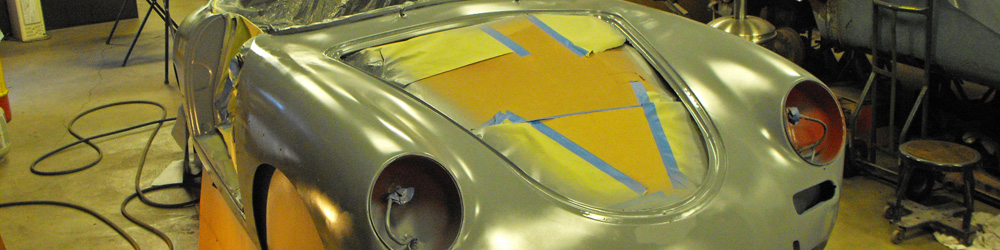 Close up picture of a Porsche 356 Roadster being restored.