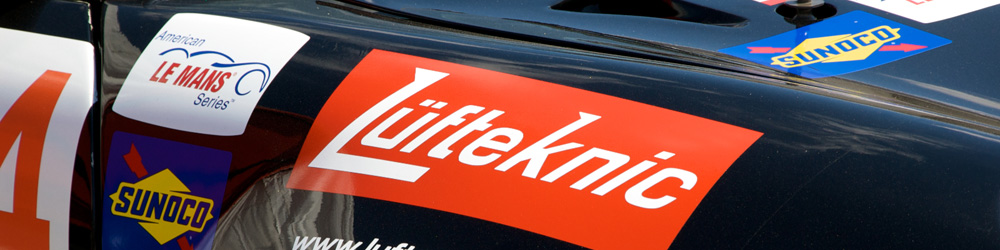 A close up image of the Lüfteknic logo on a race car fender