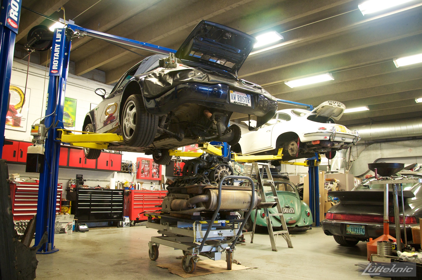 A rare 964 American Roadster inside the Lufteknic shop with the engine and transmission being removed.