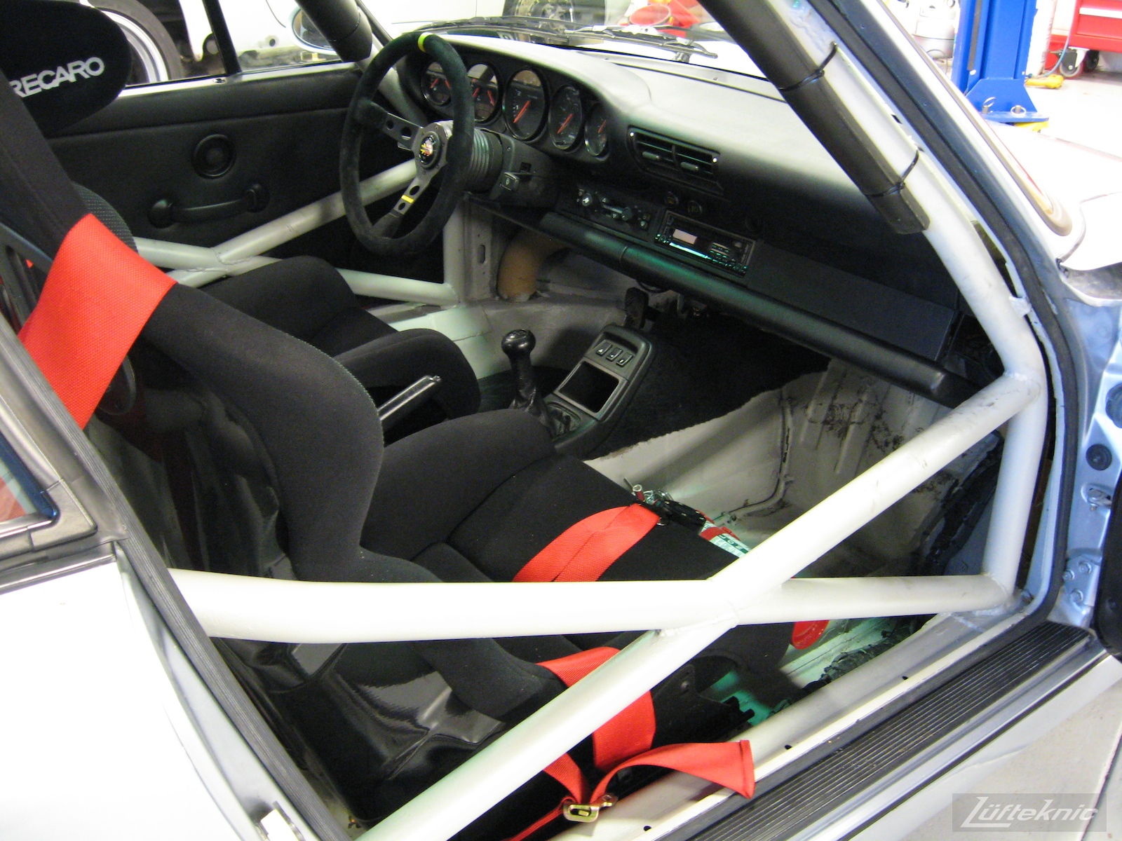 The completed 964 RS America project showing the safety cage, seats and fire extinguisher.