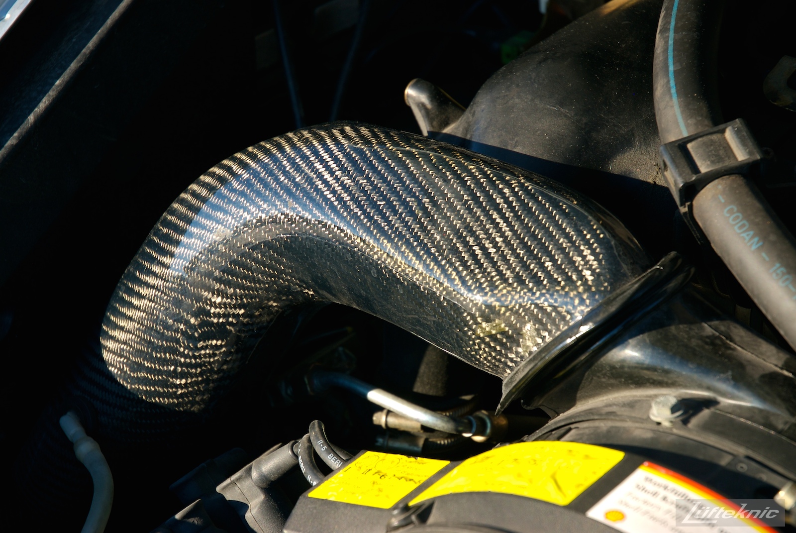 Carbon fiber engine heater pipe shown on the RS America.