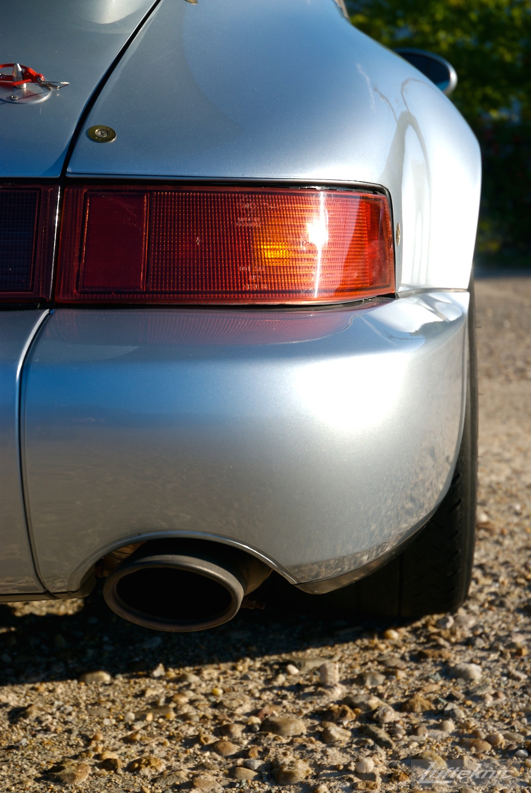 A rear detail shot of the bumper and exhaust tip on the 964 RS America.