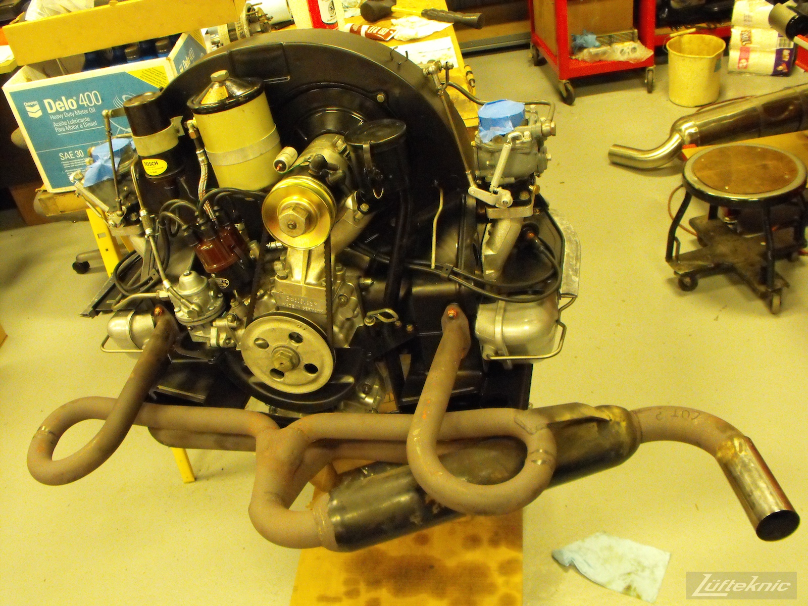 Engine with muffler for a 1961 Porsche 356B Roadster restoration.