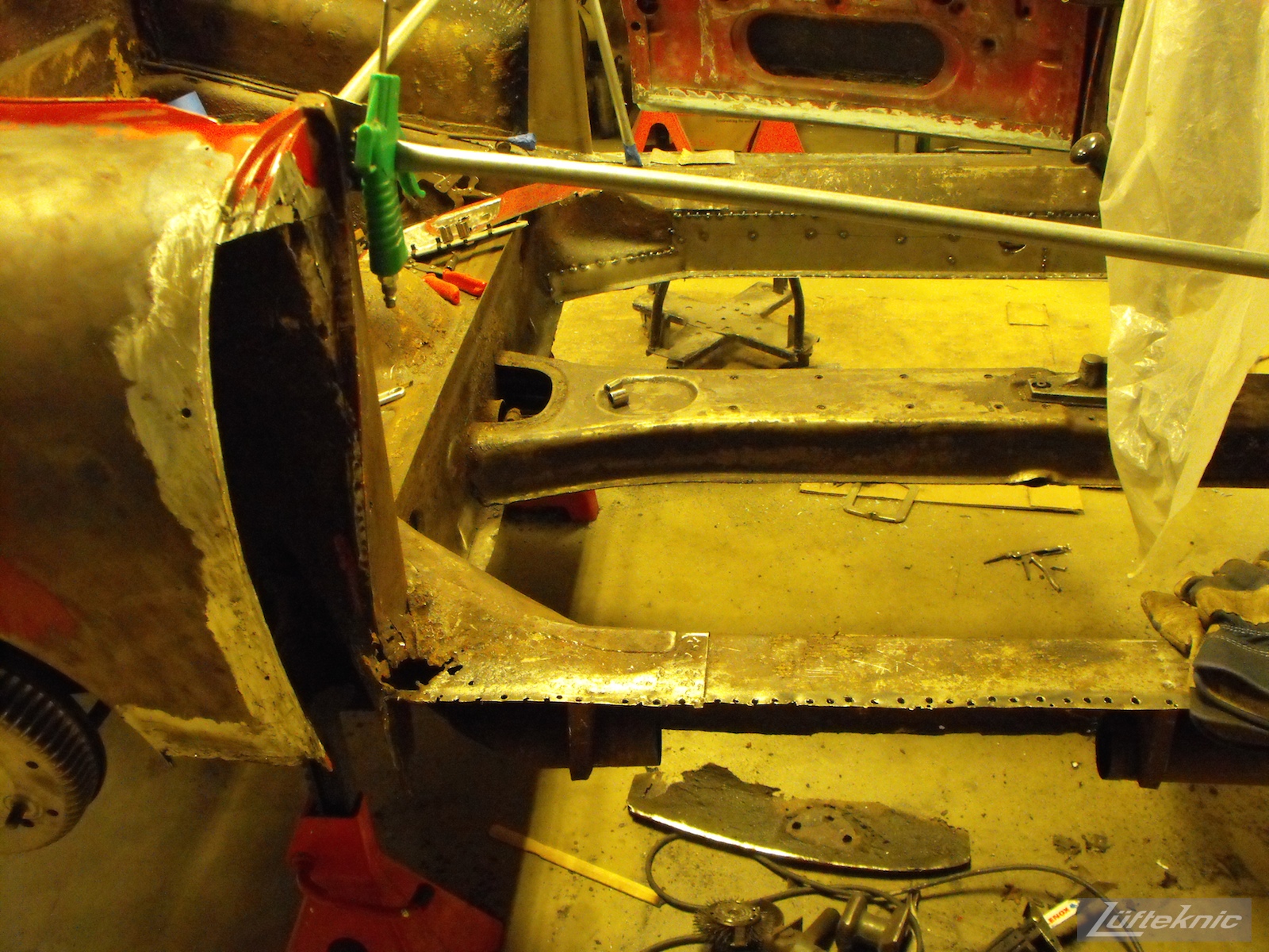 Deep into rust repair on a 1961 Porsche 356B Roadster restoration.