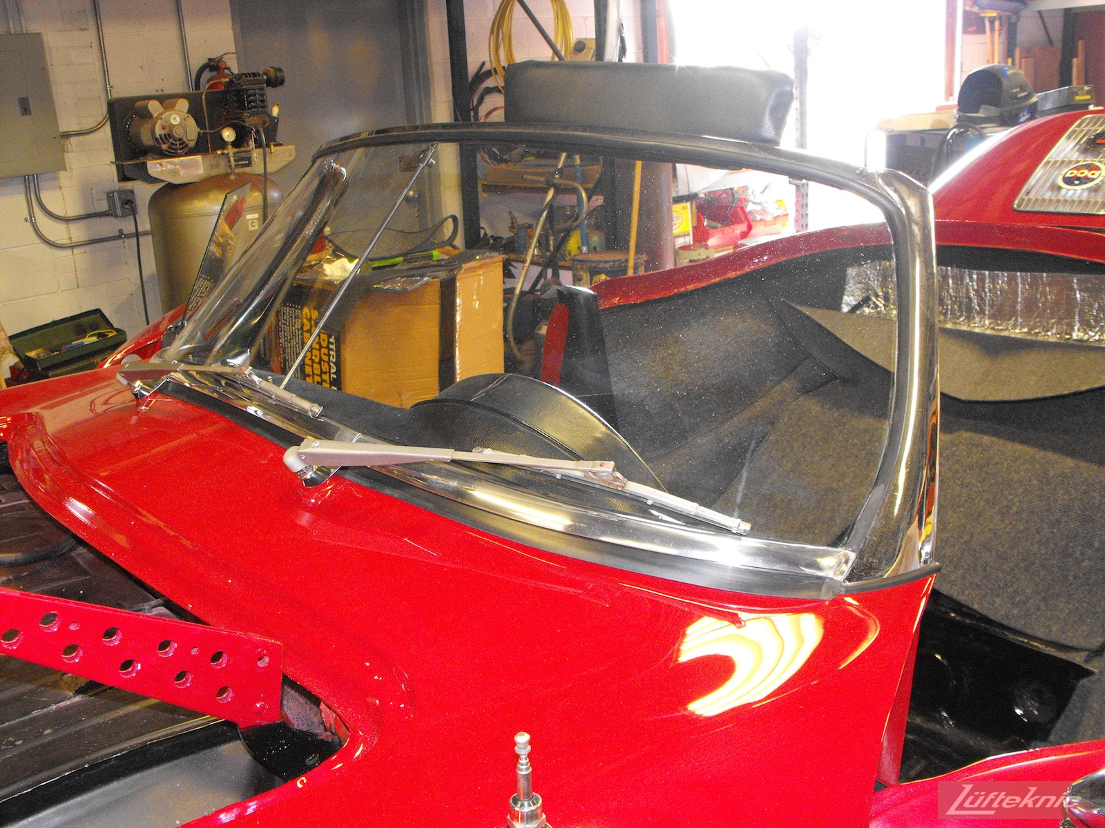 Windshield installed on a 1961 Porsche 356B Roadster restoration.
