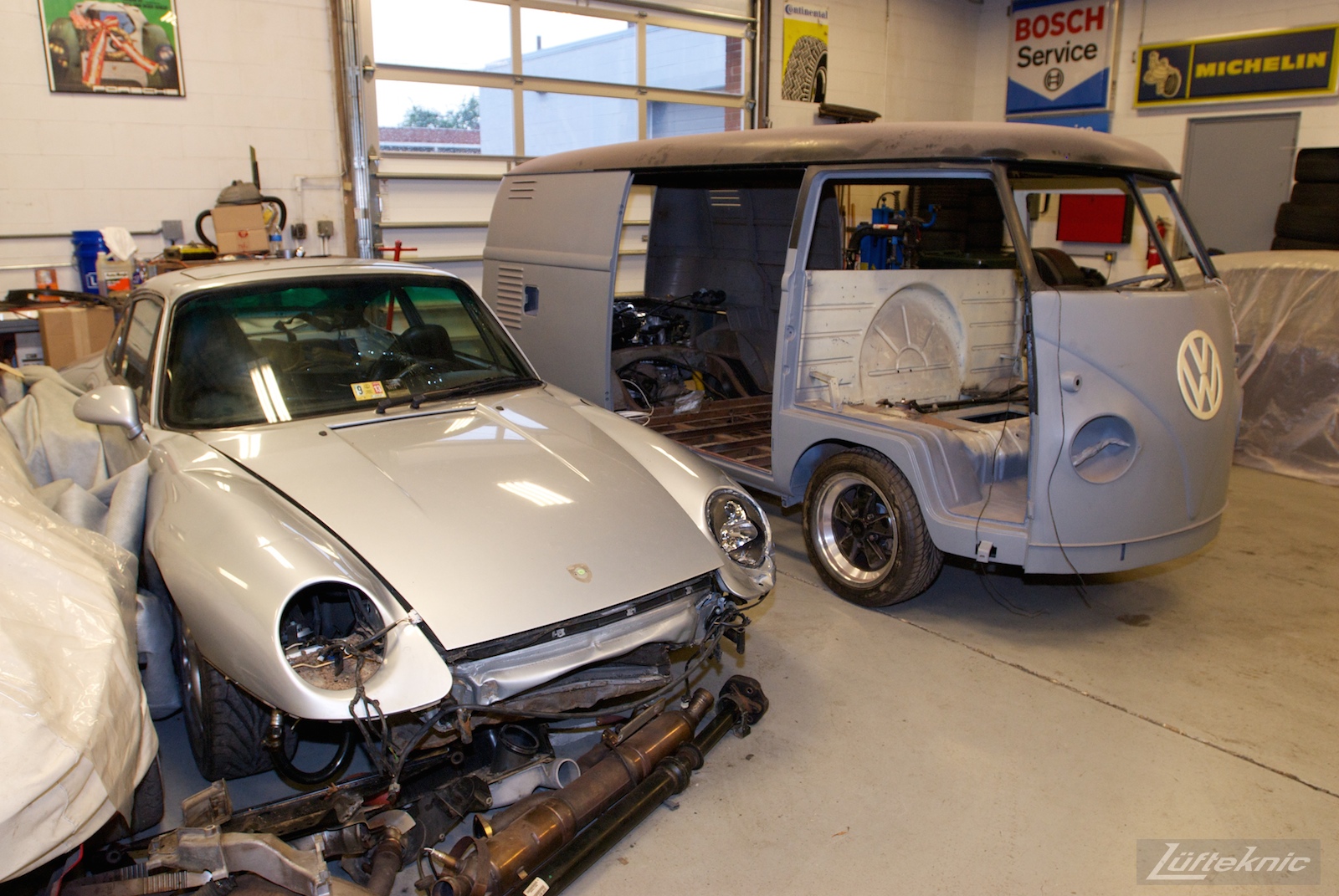 1956 Volkswagen double panel Transporter Porsche Bus with engine installed next to donor car.
