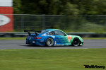 The iconic teal and blue Falken Tire Porsche 911 RSR at Lime Rock Park