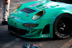 The iconic teal and blue Falken Tire Porsche 911 RSR with front end damage after winning at Baltimore.