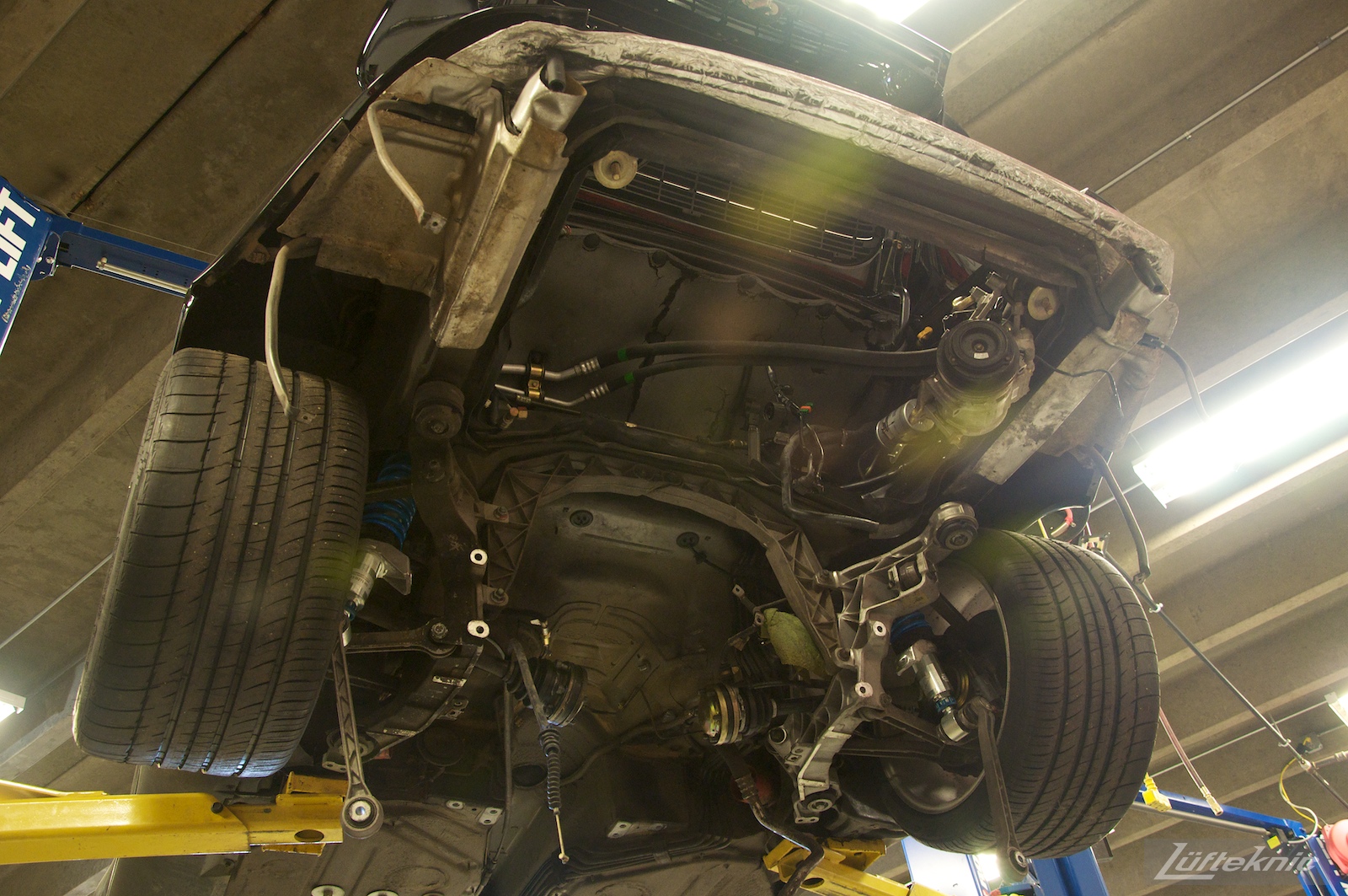A 993 Turbo viewed from below with no engine or transmission installed.