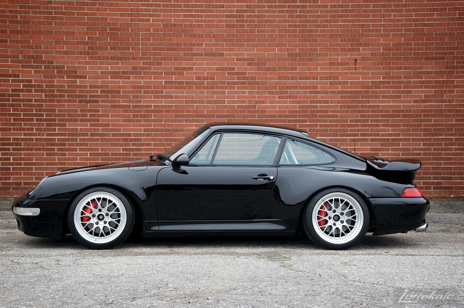 A black 993 Porsche Turbo GT2 conversion sits in the Lufteknic parking lot.