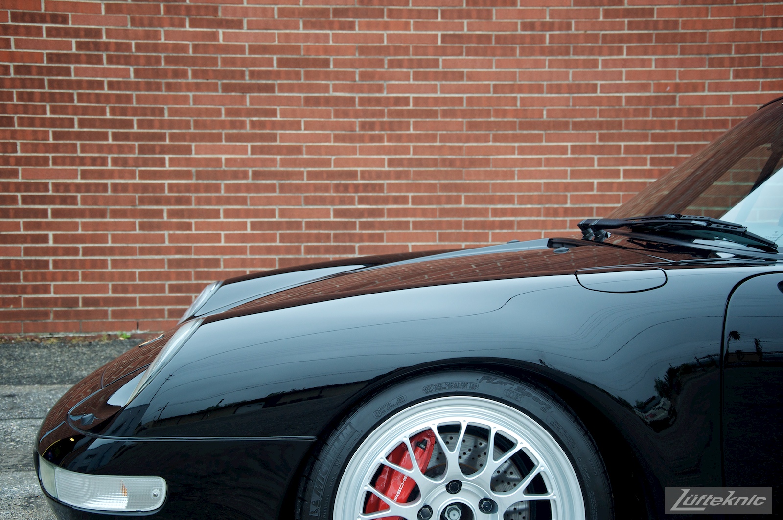 A black 993 Porsche Turbo GT2 conversion sits in the Lufteknic parking lot.