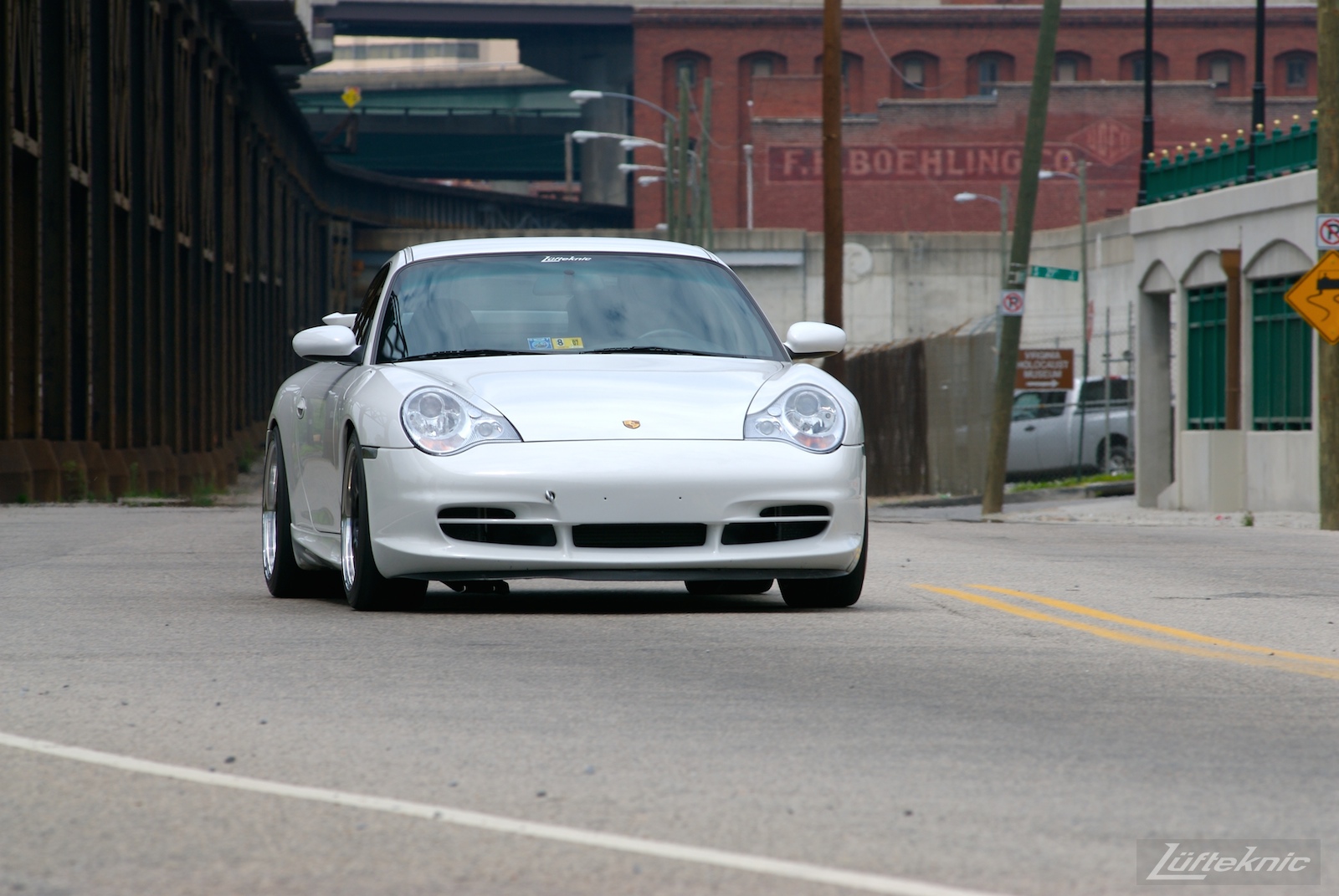 A track-prepped white Porsche 996 Gt3 with Fikse wheels.