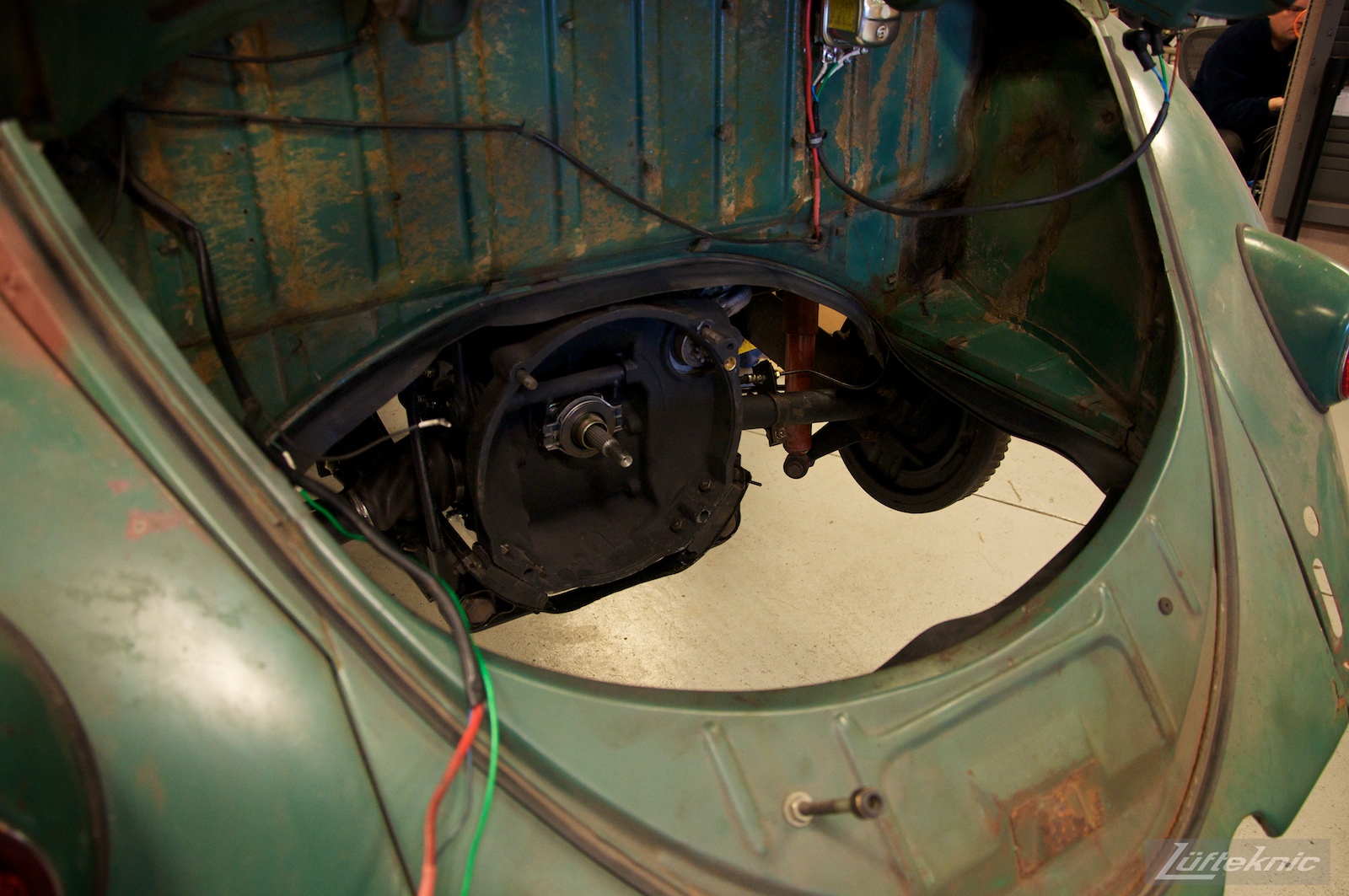 All original green 1960 Beetle with a Porsche 356 engine ready for install.