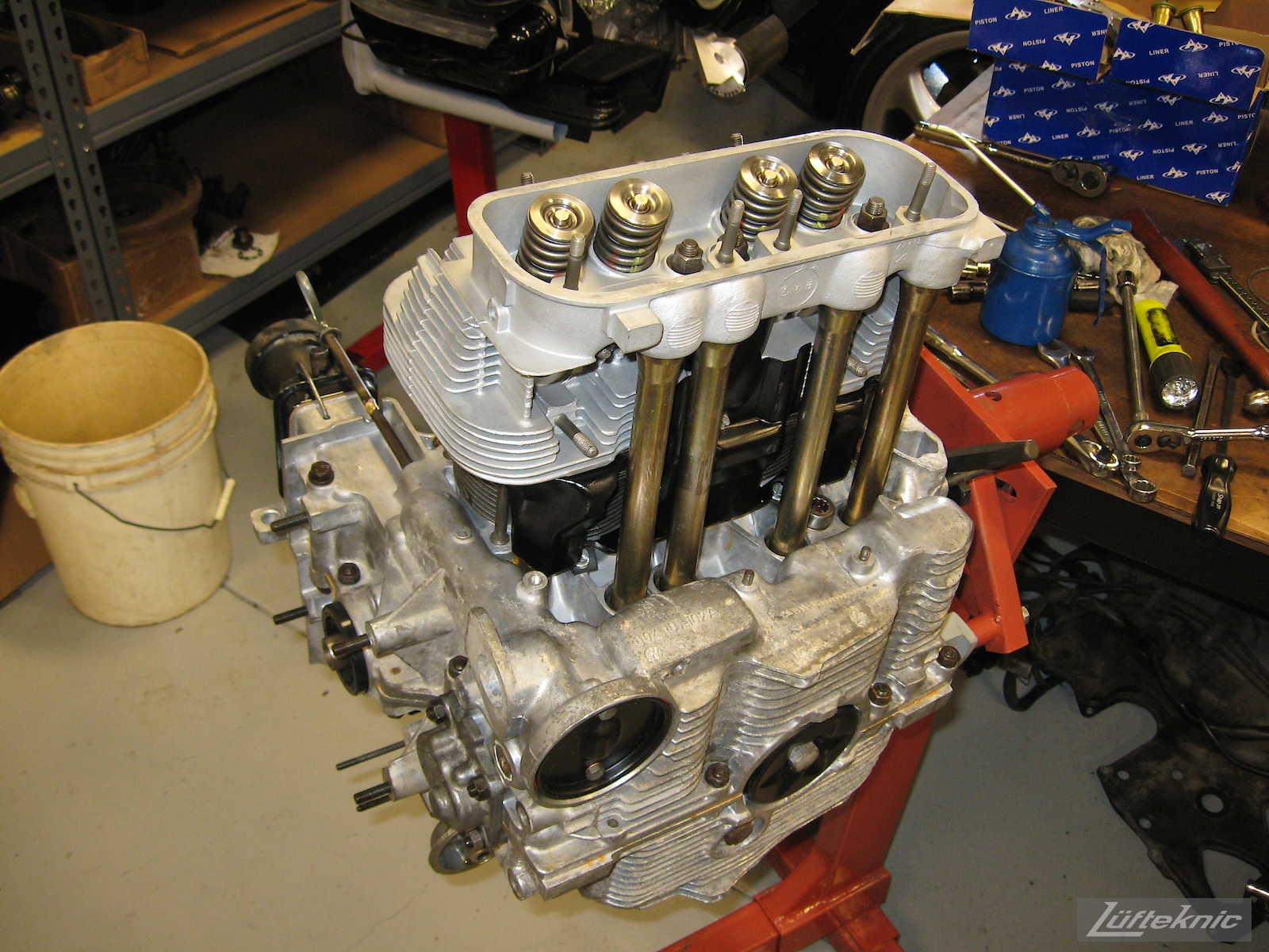 Nearly complete engine for a restored yellow Porsche 914 at Lufteknic.