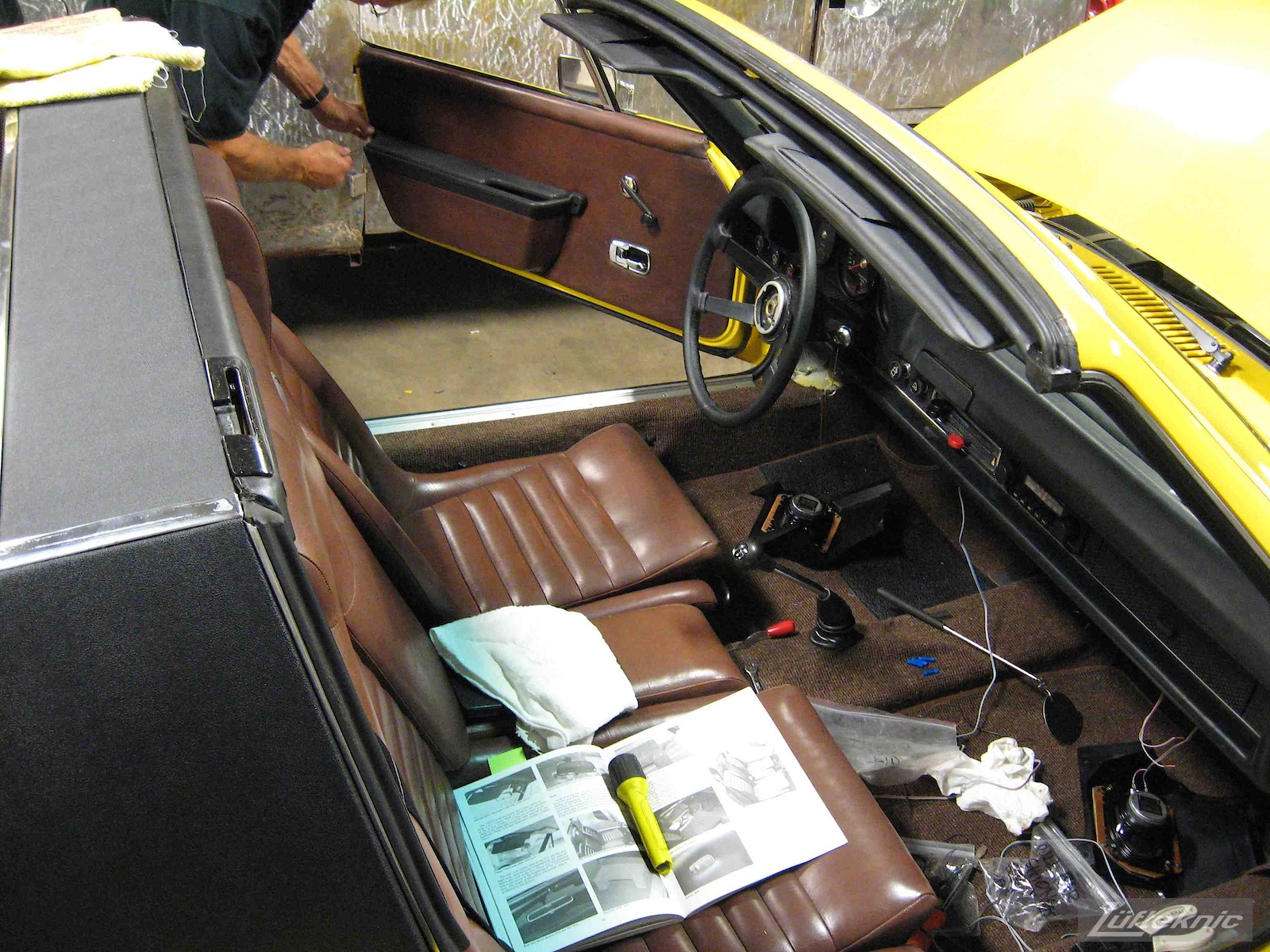 Brown original interior installed into a restored yellow Porsche 914 at Lufteknic.