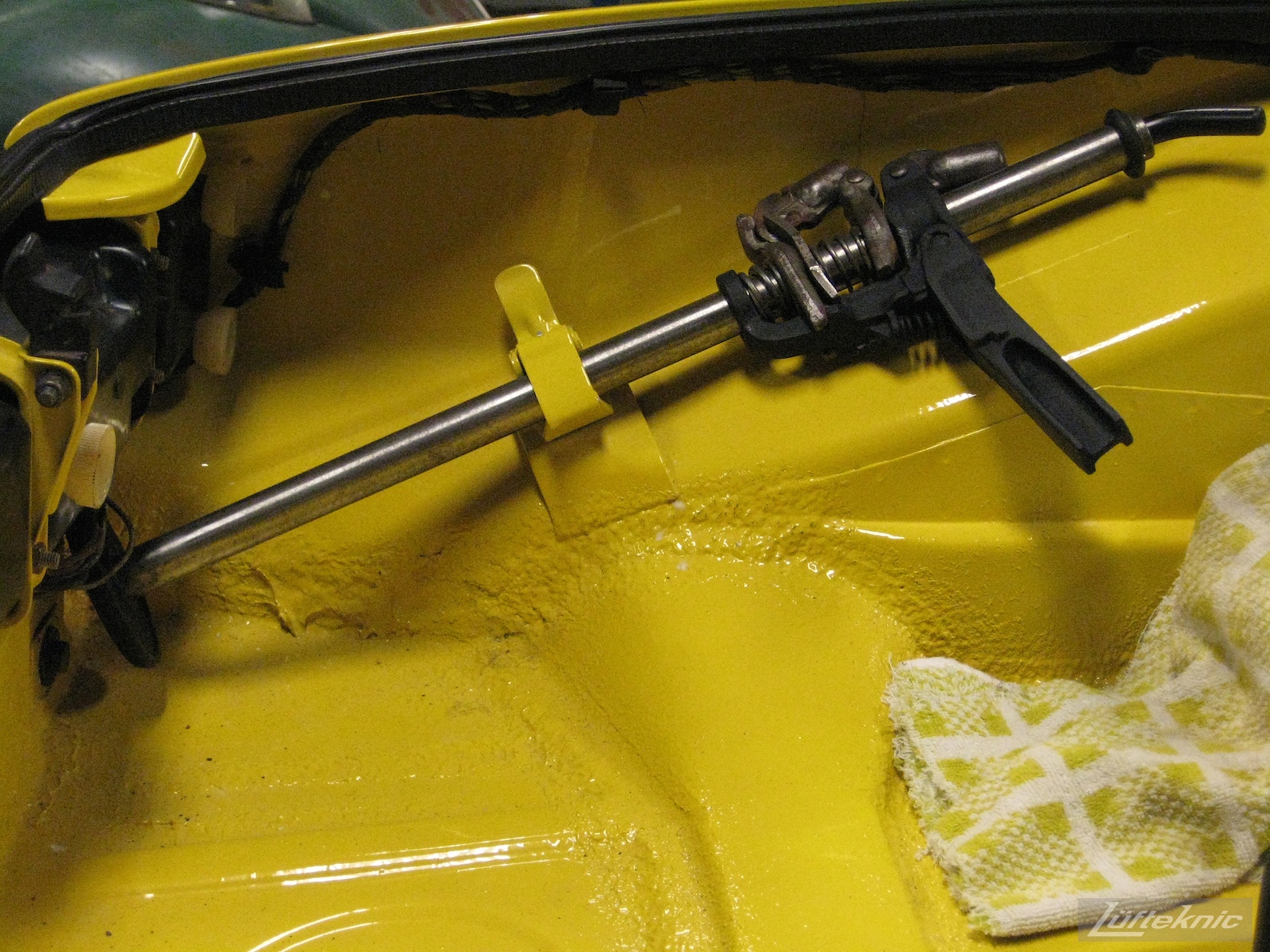 Interior trunk details of a repaired and restored yellow Porsche 914 at Lufteknic.