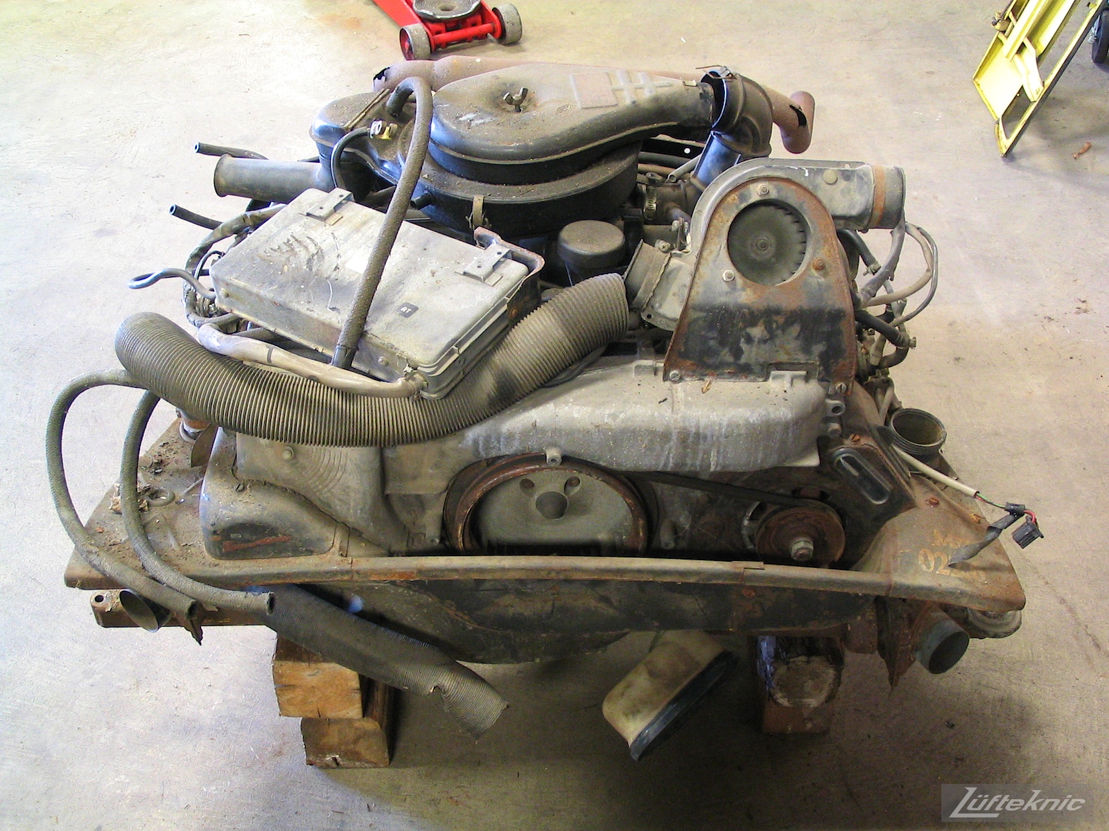 A neglected 914 engine sitting on blocks after removal from a 914 being restored.