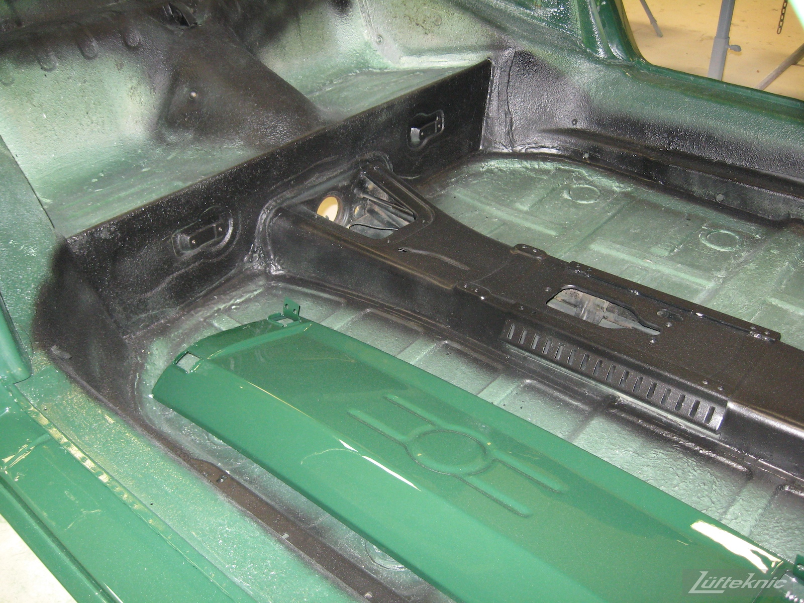 Body panel and floors of an Irish Green Porsche 912 undergoing restoration at Lufteknic.
