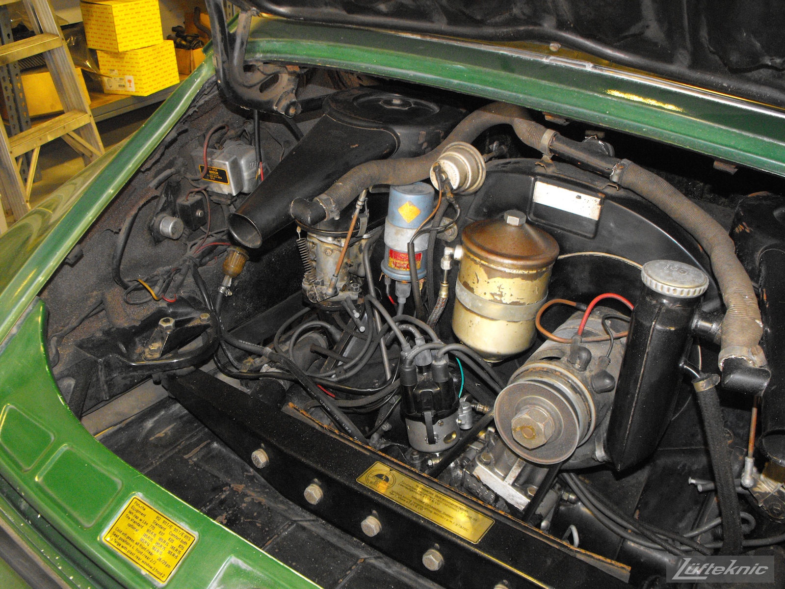 An overall picture of the engine bay of an Irish Green Porsche 912 undergoing restoration at Lufteknic.