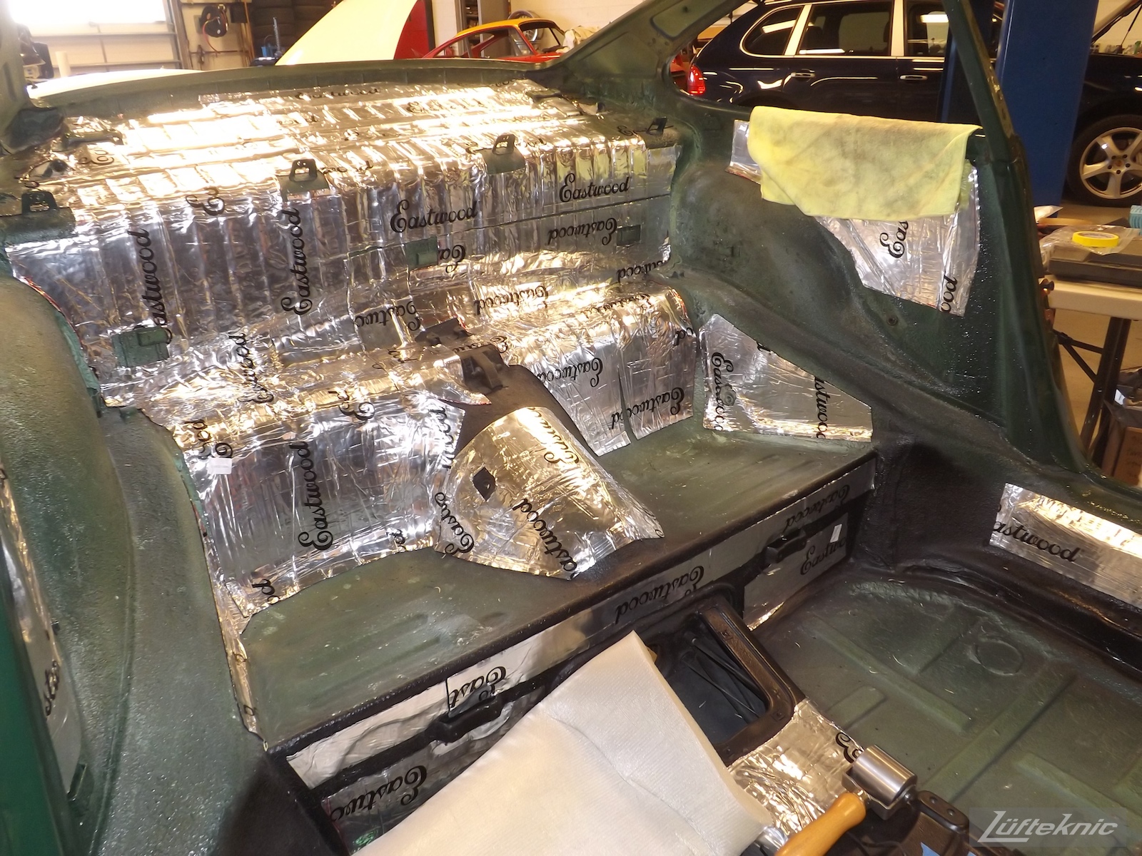 Eastwood sound deadening panels installed on an Irish Green Porsche 912 undergoing restoration at Lufteknic.