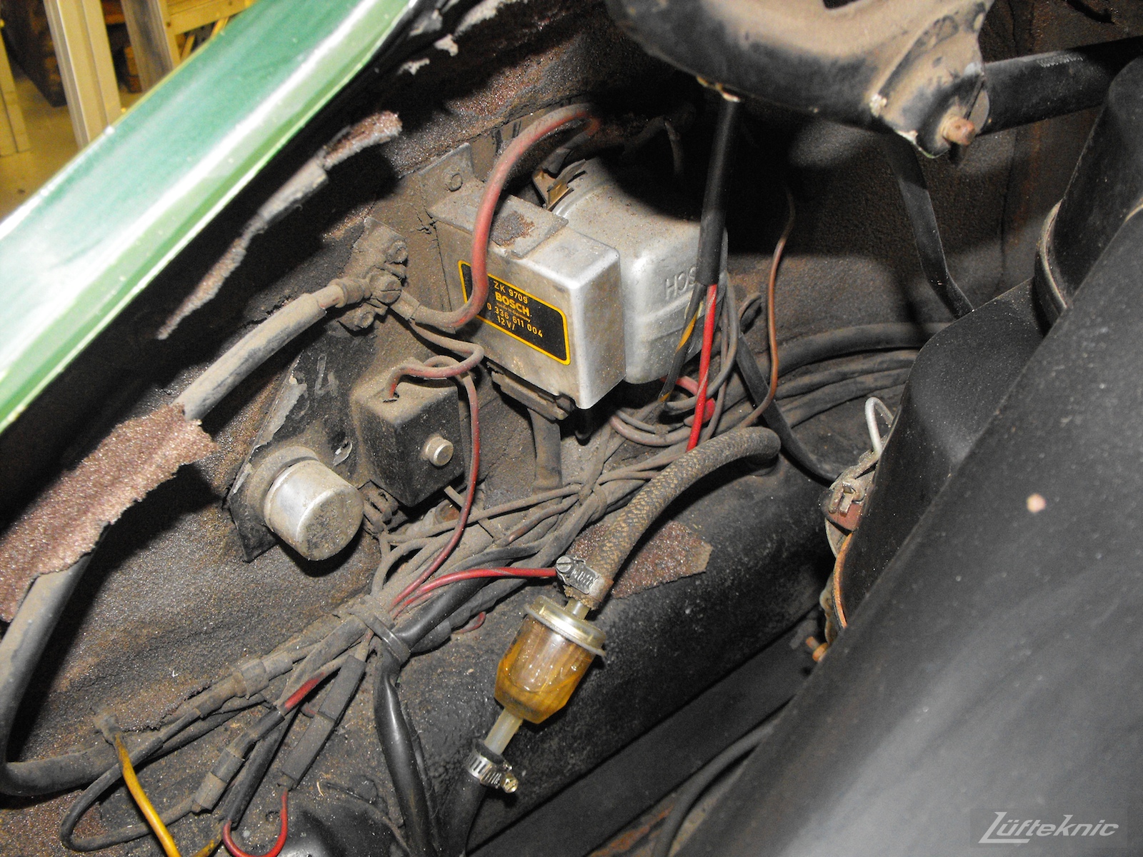 Dirty components of an Irish Green Porsche 912 undergoing restoration at Lufteknic.
