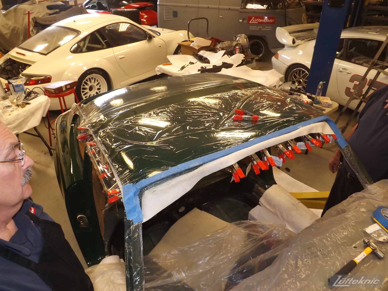 Headliner installation on an Irish Green Porsche 912 undergoing restoration at Lufteknic.