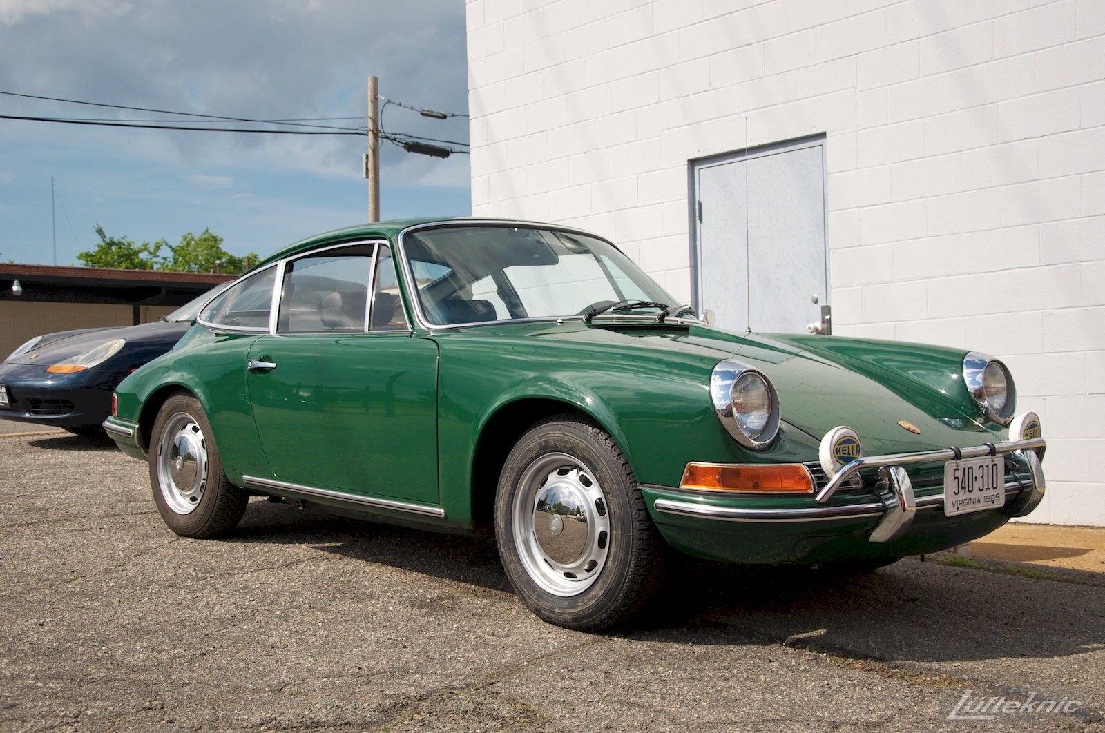 An Irish Green Porsche 912 which has been completely restored by Lufteknic sitting in the shop parking lot.