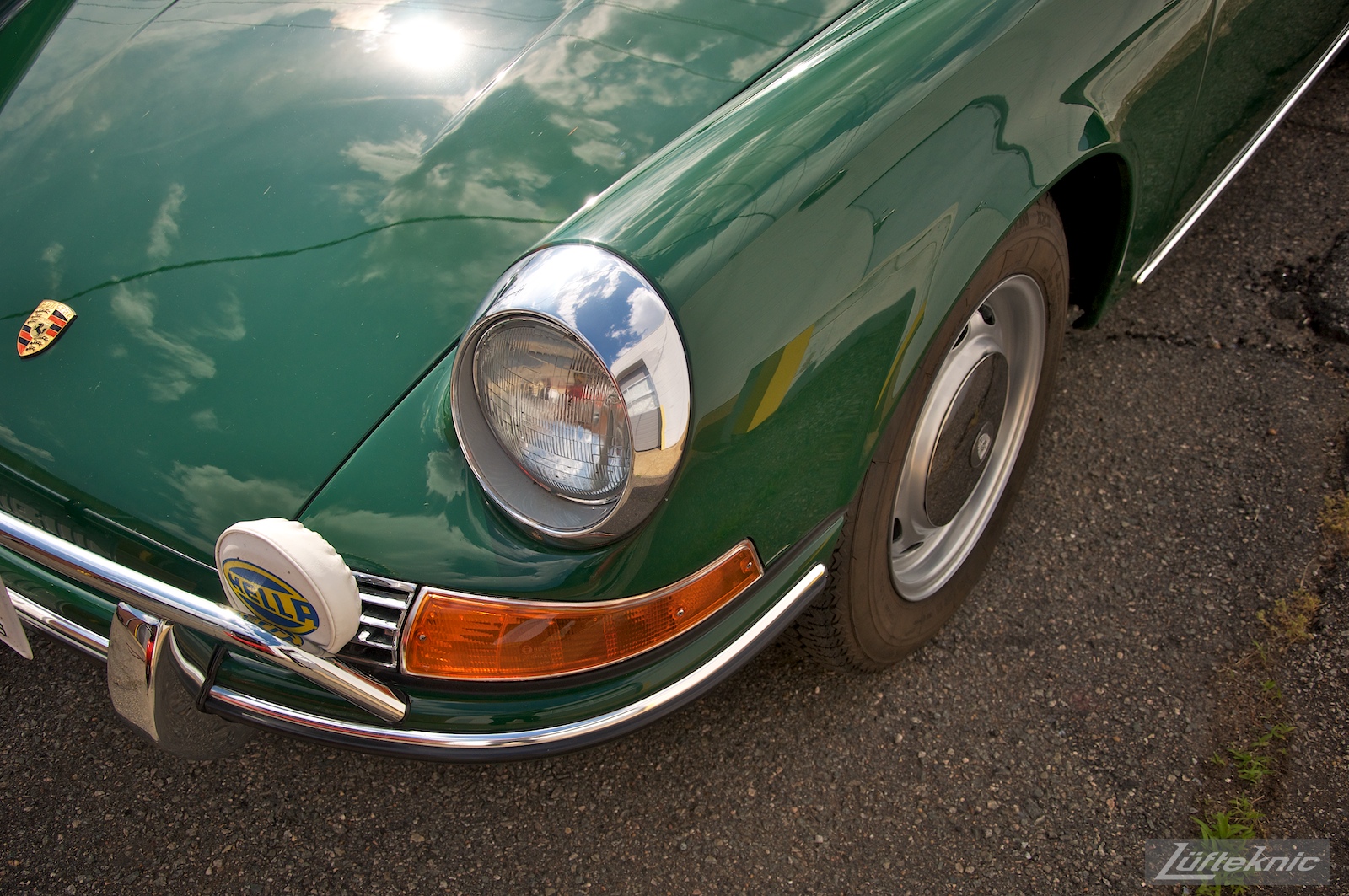 An Irish Green Porsche 912 which has been completely restored by Lufteknic sitting in the shop parking lot.