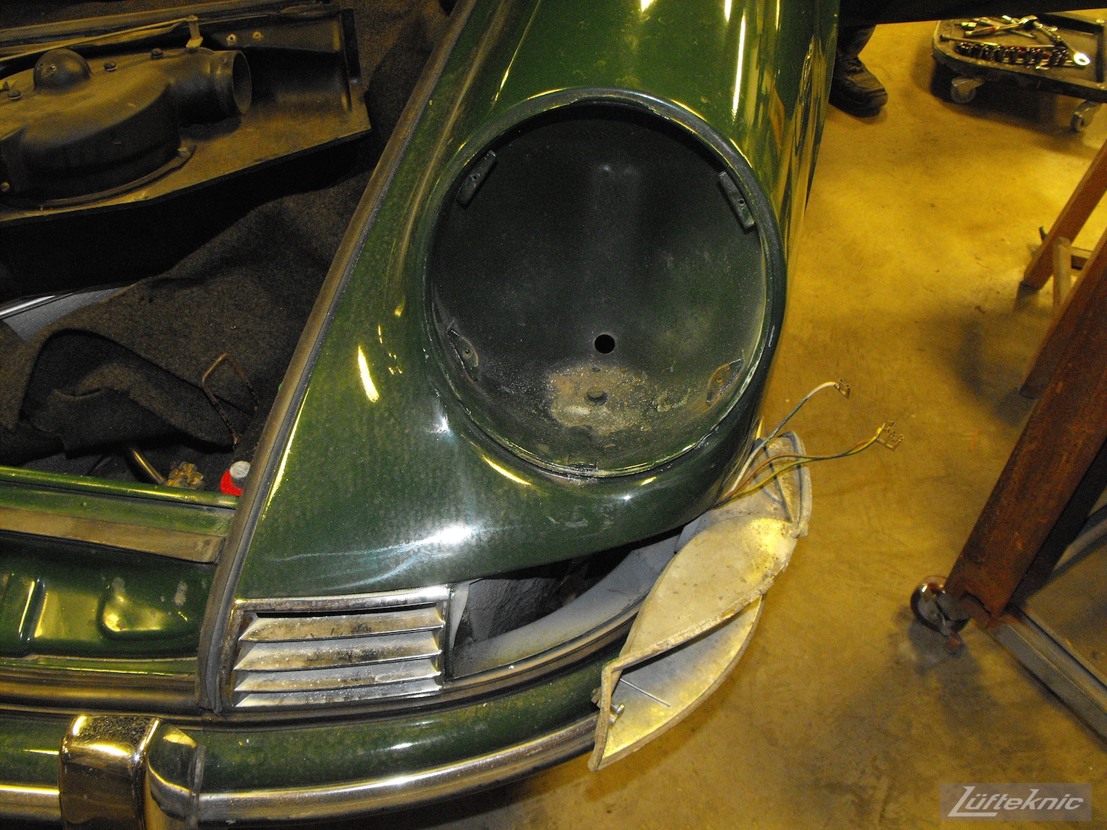 Front fender with lights removed on an Irish Green Porsche 912 undergoing restoration at Lufteknic.