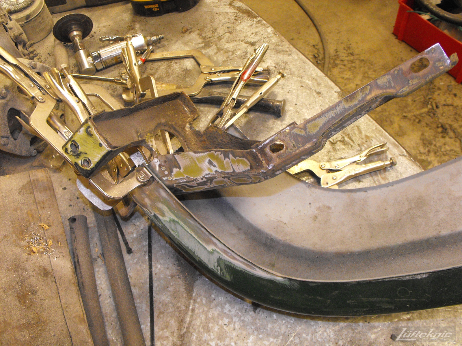 Front bumper repair on an Irish Green Porsche 912 undergoing restoration at Lufteknic.
