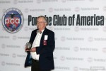 Deane receives his award at Porsche Parade
