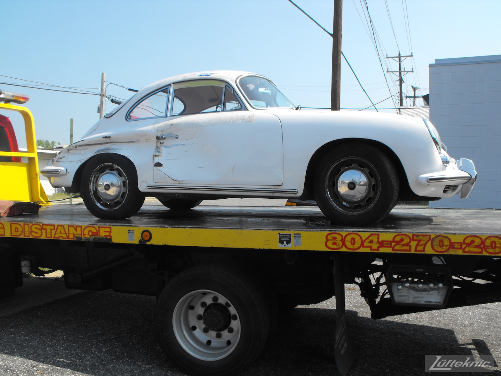 1964 Porsche 356SC restoration being towed in.